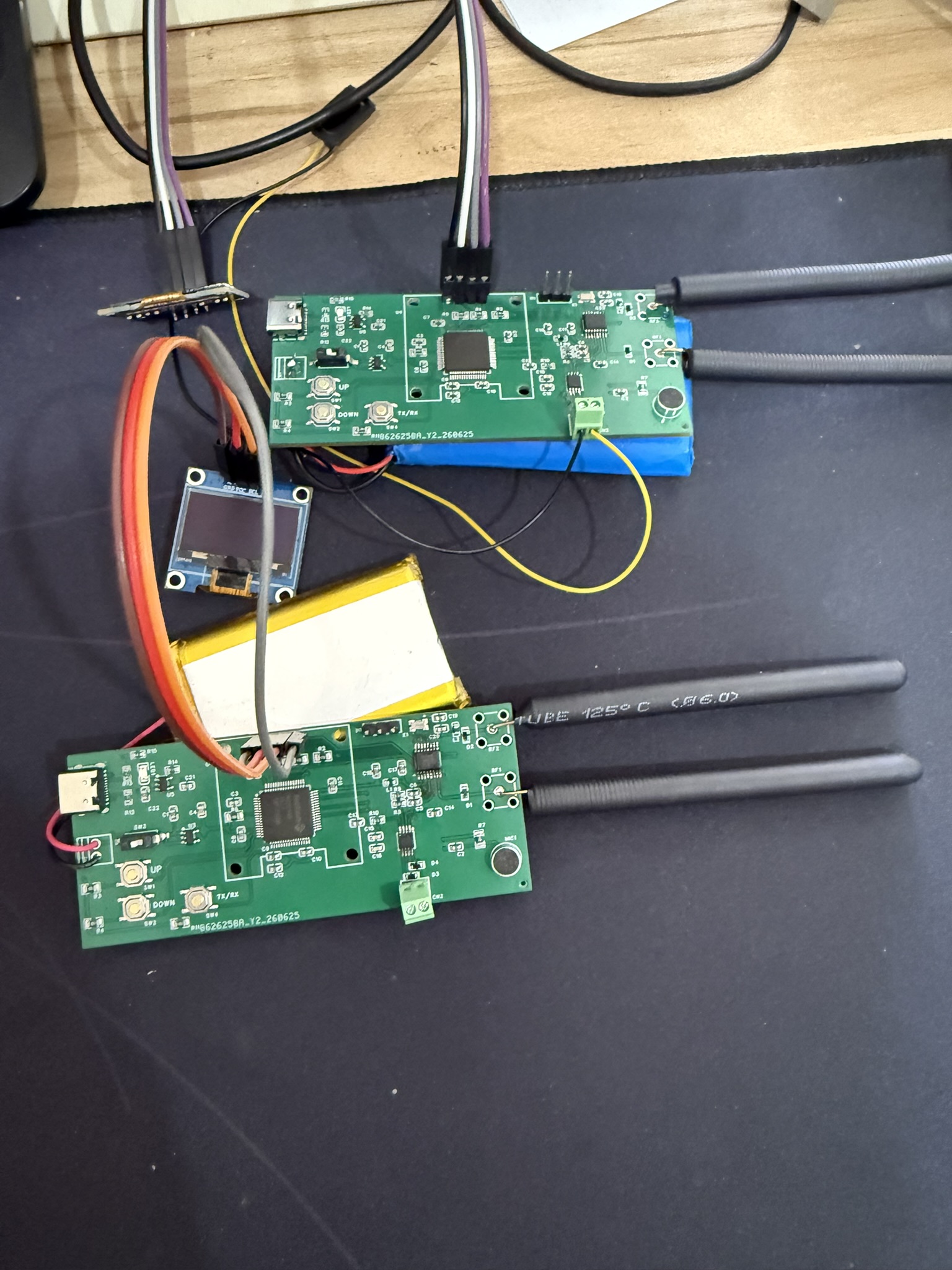 FM transceiver PCBs with antennas, OLED display, and batteries